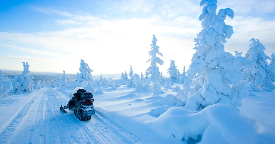 A snowmobile on a snowy fell